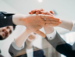 teamwork cooperation unity. business people hands together. strength partnership. joined forces to make a prosperous and successful company